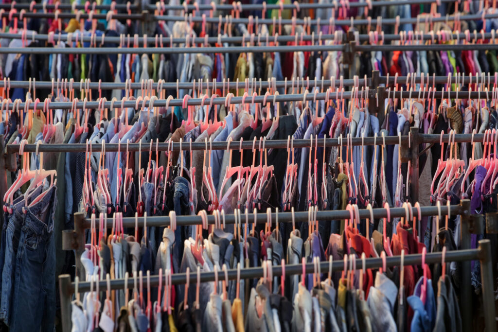 Several racks of vintage clothing show the choice available.